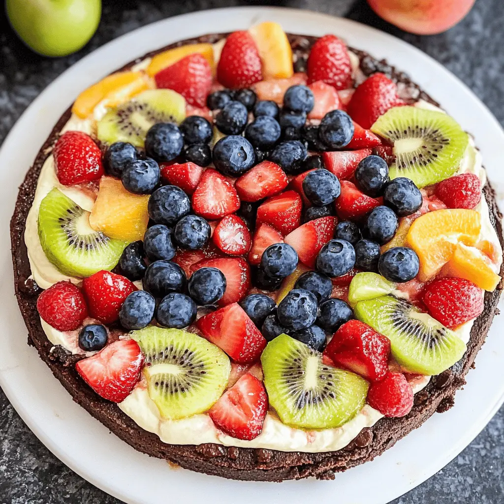 This delightful Brownie Fruit Pizza is perfect for any gathering! Featuring a rich brownie base topped with creamy frosting and an assortment of fresh fruits, it's a colorful and tasty treat that everyone will love. Great for parties or as a cheerful dessert after dinner. Save this recipe now and impress your guests with a fun twist on pizza!