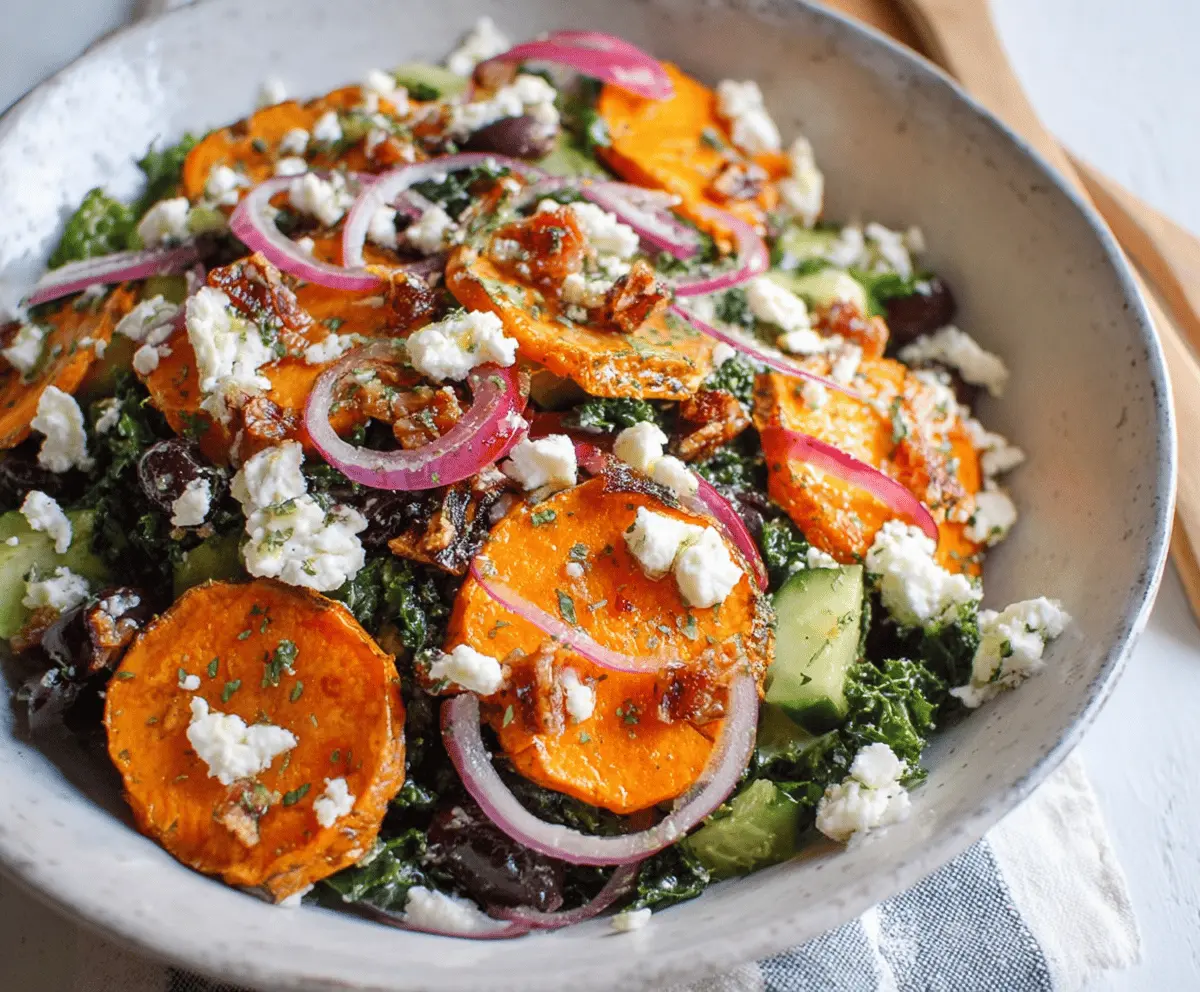 Colorful sweet potato Greek salad with feta cheese, olives, and fresh herbs on a rustic plate