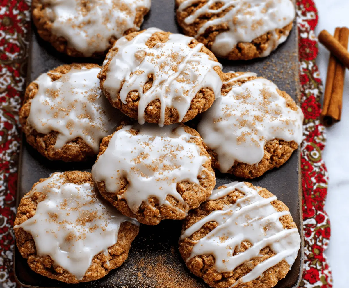Delicious iced gingerbread oatmeal cookies on a plate, perfect for holiday treats.
