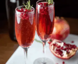 Elegant Pomegranate Prosecco Cocktail with fresh pomegranate seeds and a shimmering glass.