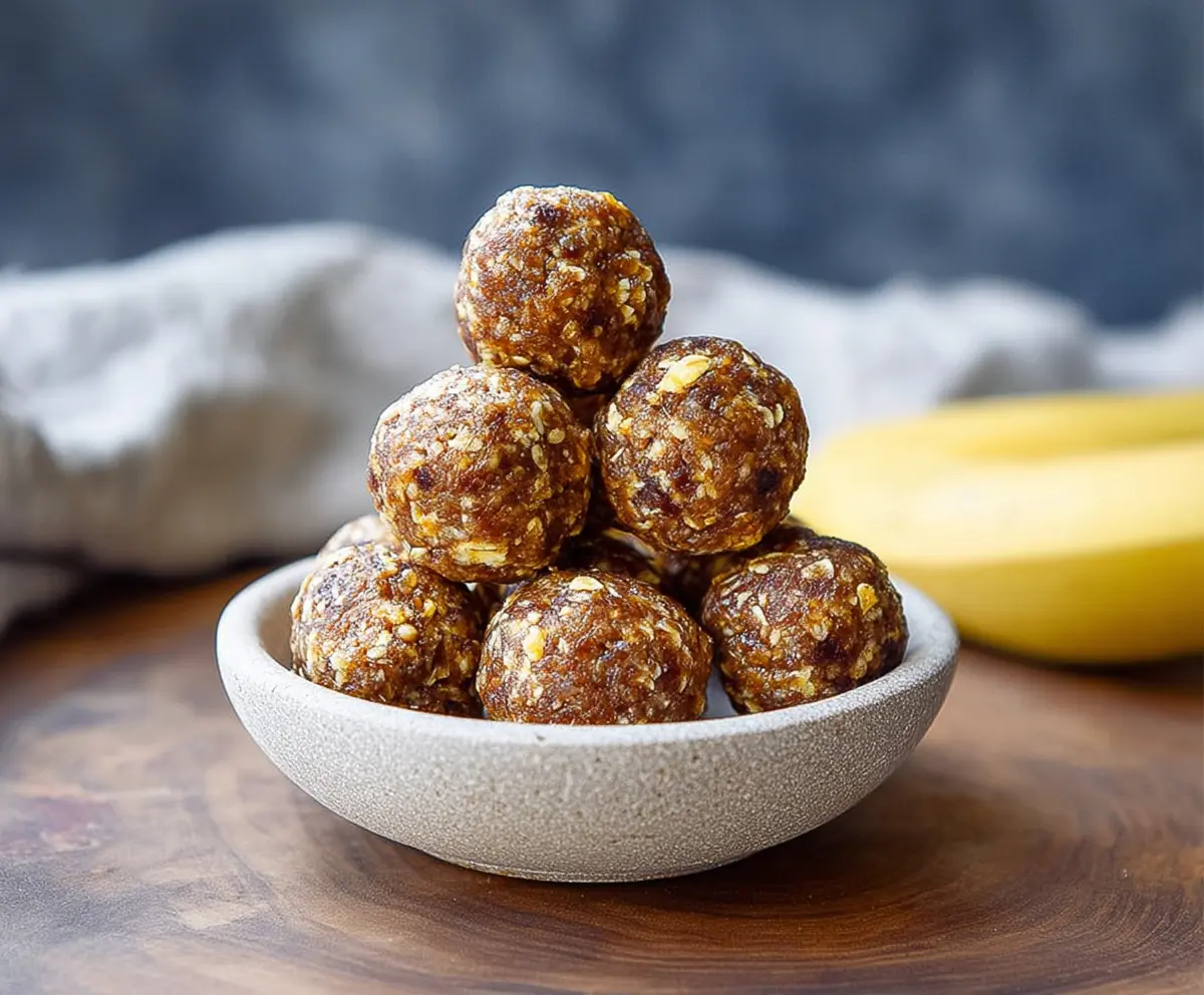 Healthy banana energy balls made with oats, honey, and nuts for a nutritious snack.