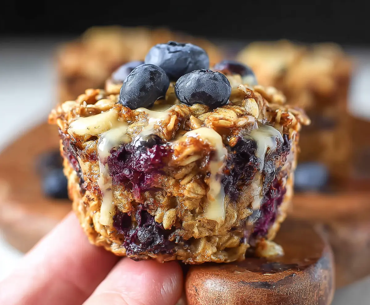 Delicious blueberry banana baked oatmeal cups in a baking dish, perfect for a healthy breakfast.