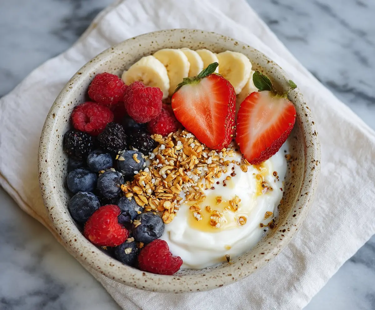 Healthy protein yogurt bowl with fresh fruits and granola for a nutritious breakfast