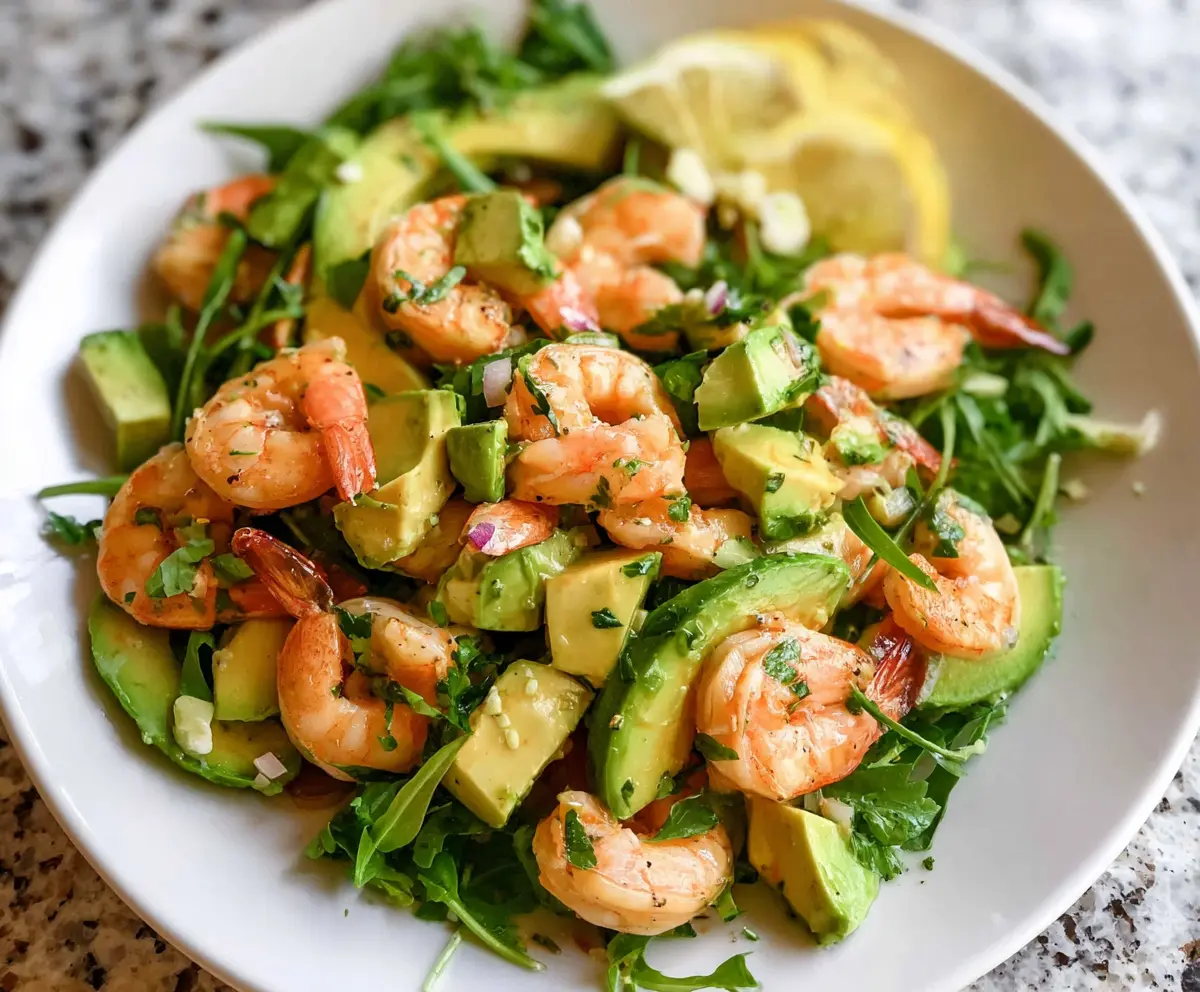Fresh shrimp and ripe avocado salad served with vibrant greens for a healthy meal