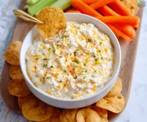 Creamy Cheddar Ranch Dip served with fresh vegetable sticks for a delicious appetizer.