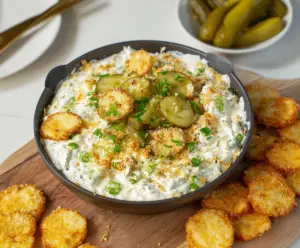 Creamy fried pickle dip served with crispy snacks, perfect for appetizers and parties.