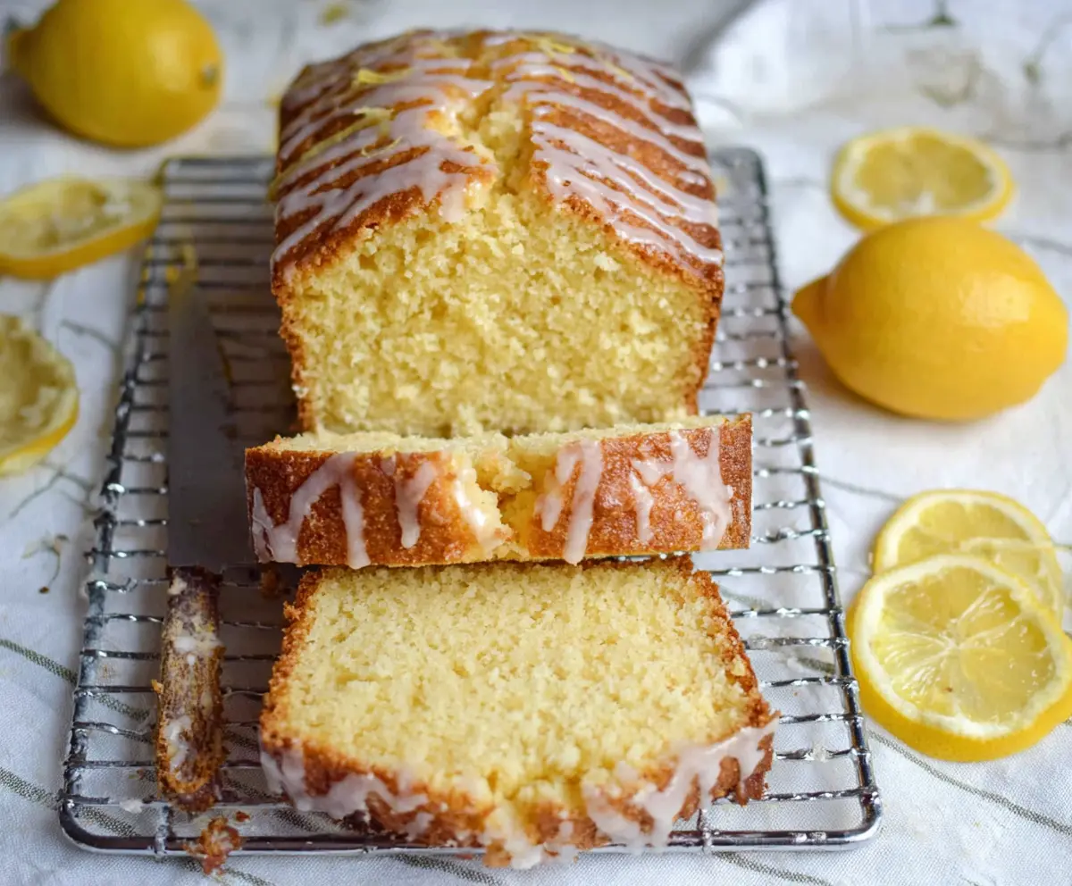 Delicious Lemon Sourdough Discard Cake with a golden crust and lemon slices on top.