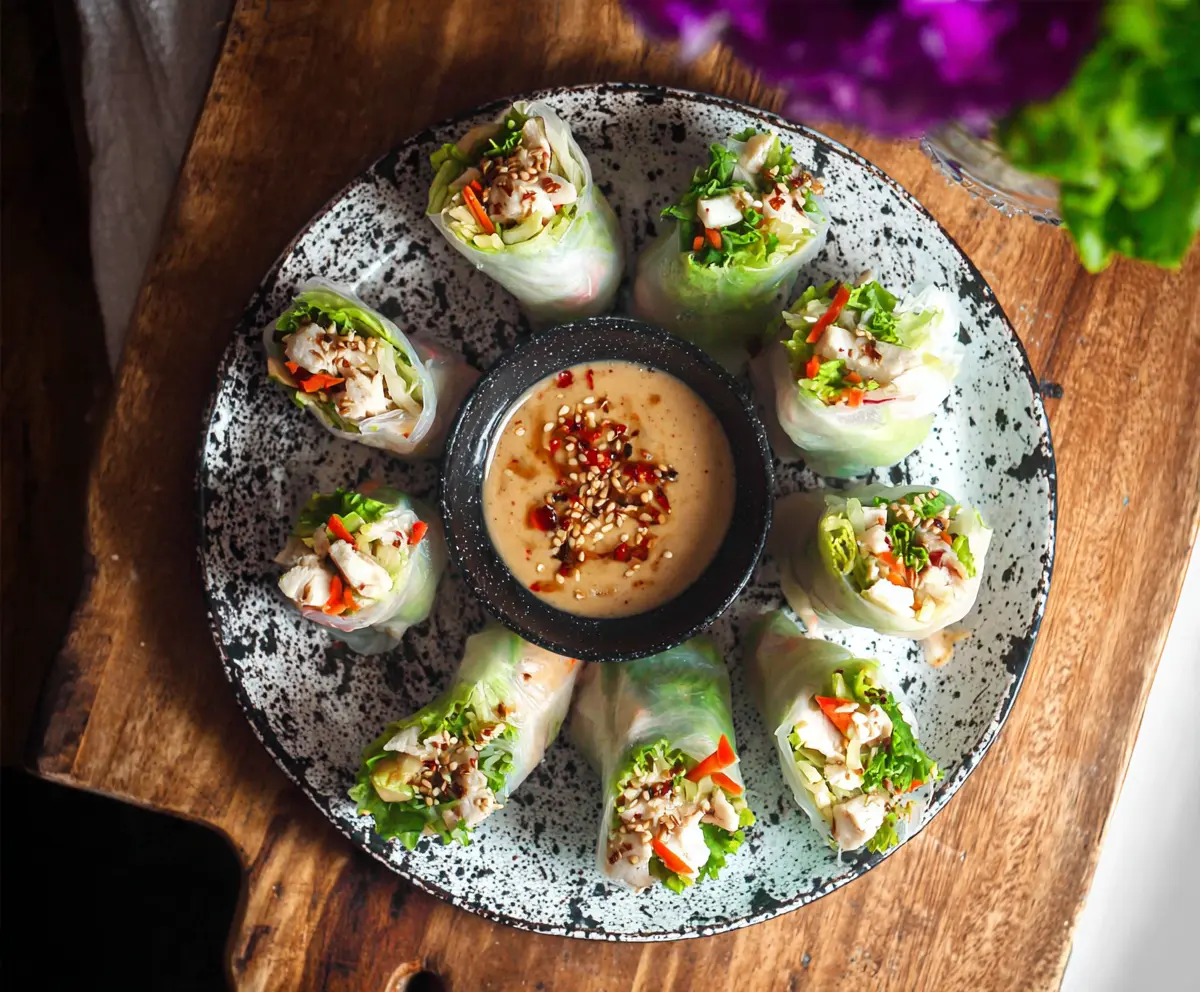 Delicious Caesar Chicken Rice Paper Rolls with fresh vegetables and creamy dressing