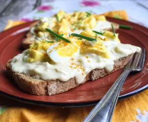 Delicious creamed eggs on toasted bread served for breakfast or brunch.